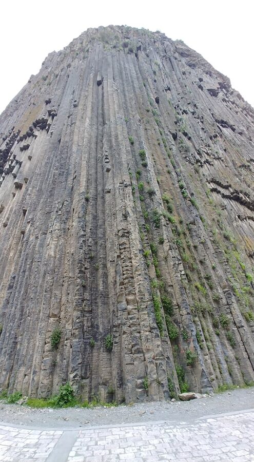 Closeup of basalt columns at Symphony of Stones with sun-dappled stone faces