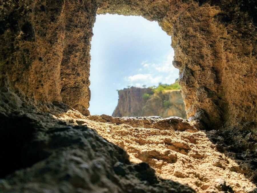 Sunbeam through the rock-cut cave at Geghard Monastery, Armenia
