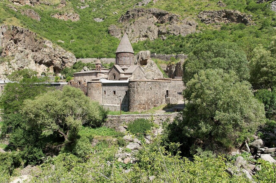 Geghard Monastery sitting against the cliffs above the Azat River
