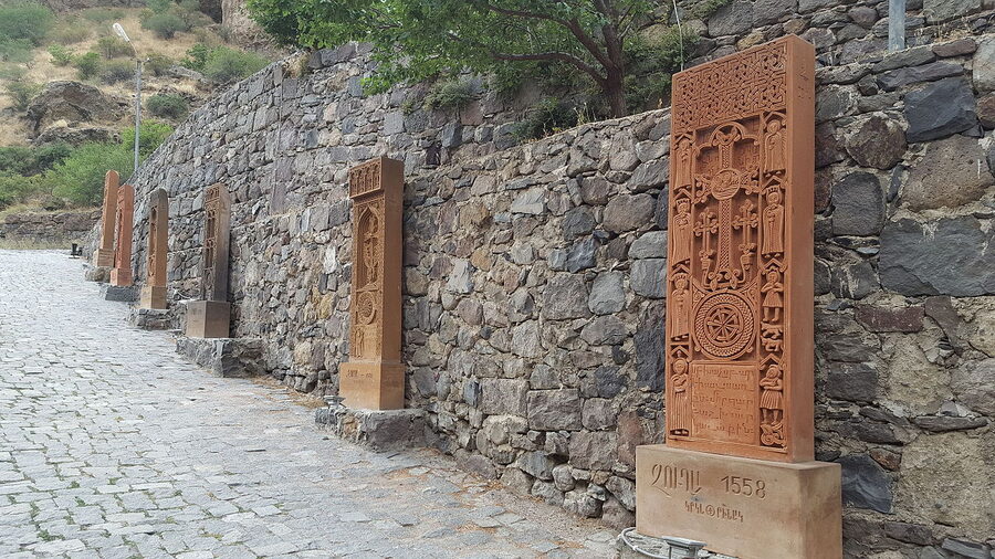 Khachkars carved into the walls at Geghard Monastery