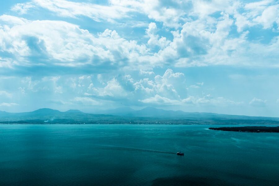 Aerial view of Lake Sevan with mountain ranges and dramatic clouds, Gegharkunik Province, Armenia