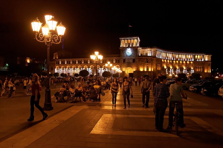 Republic Square Yerevan in the evening with people gathered around the fountains