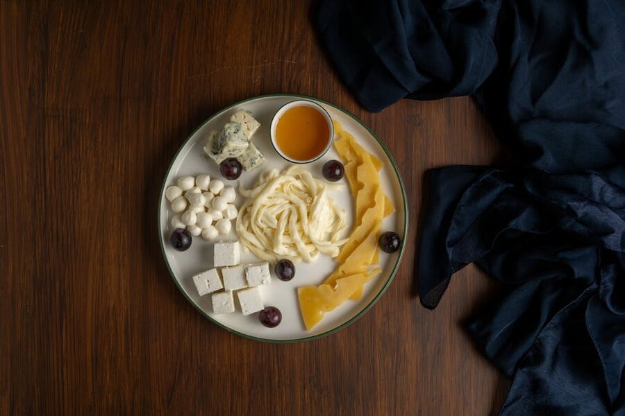Armenian cheese platter with herbs grapes and honey
