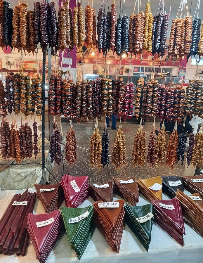 Strings of churchkhela hanging at a market stall