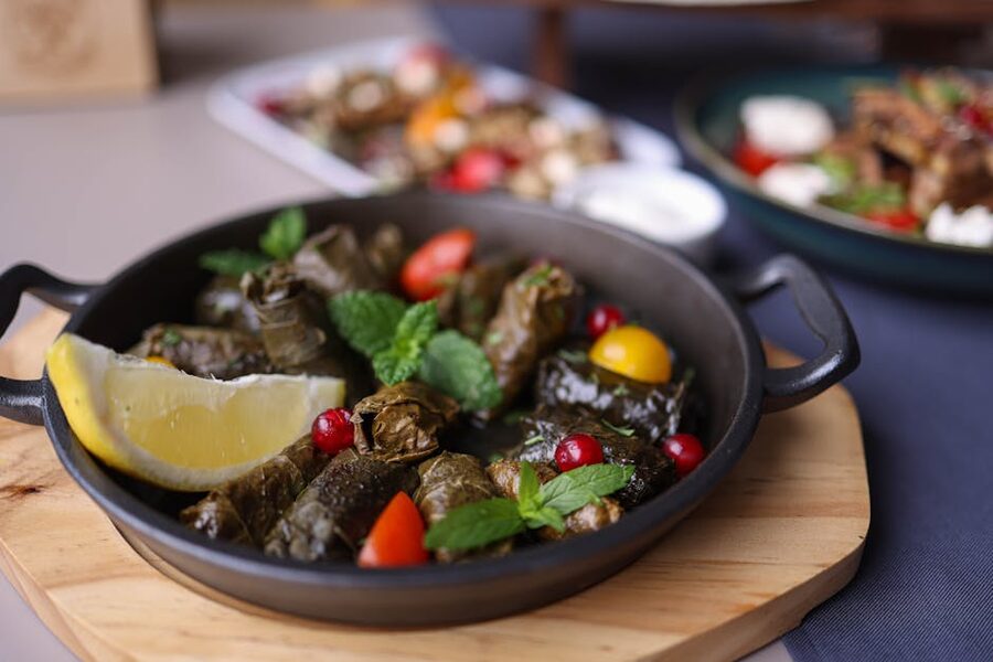 Plate of traditional dolma with garnish and lemon